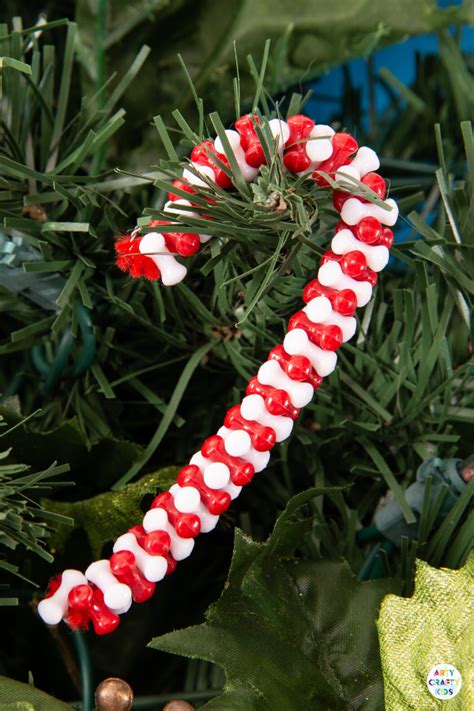 How to make a beaded candy cane ornament. Beaded Candy Cane Ornaments | Candy cane ornament, Christmas crafts decorations, Beads candy