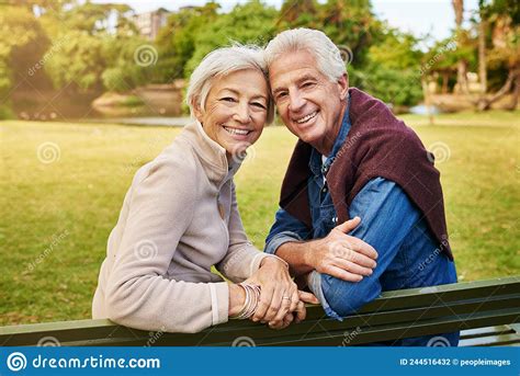 Love Has No Age Portrait Of A Happy Senior Couple Sitting On A Park