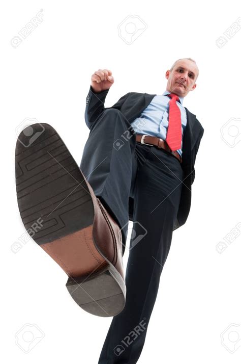 Low Angle Of Business Man Stepping On Pose Reference Photo