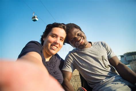 Smiling Biracial Couple Taking Selfie On Embankment Stock Image Image