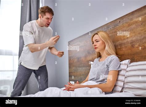 Can You Go To Do Housework Dissatisfied Man Scream At Wife She Sits On Bed Dont Looking At Him