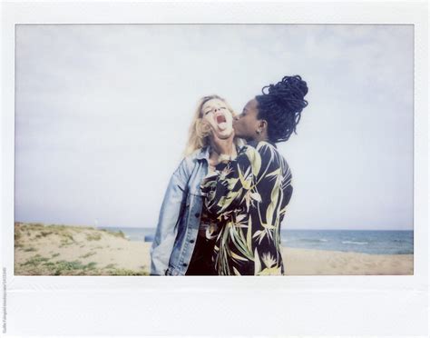 Two Funny Girlfriends Kissing At Beach By Stocksy Contributor Guille Faingold Stocksy