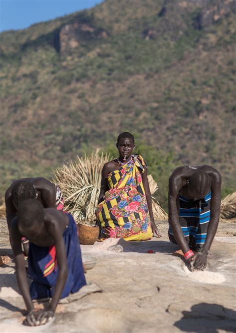 Larim Tribe Women Grinding Sorghum Grains In Holes In A Ro Flickr