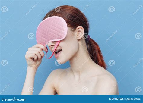 Pretty Woman With Pink Sleep Mask On Blue Background Naked Shoulders Smile Model Stock Image