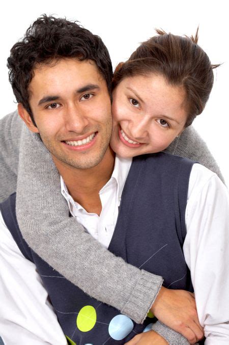 Casual Couple Of Young Adults Smiling Isolated Over A White Background