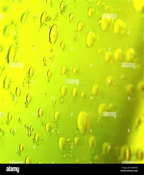 Green Abstract Blurred Liquid Background With Soap Bubbles Stock Photo