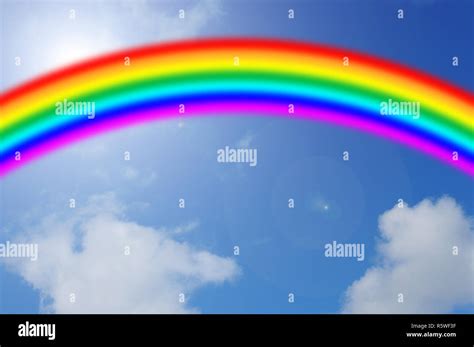 Blue Sky With Rainbow Stock Photo Alamy