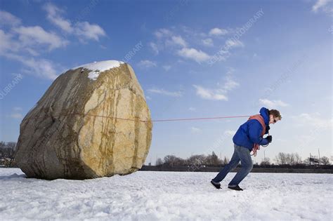 Man Pulling Boulder Stock Image F0037274 Science Photo Library