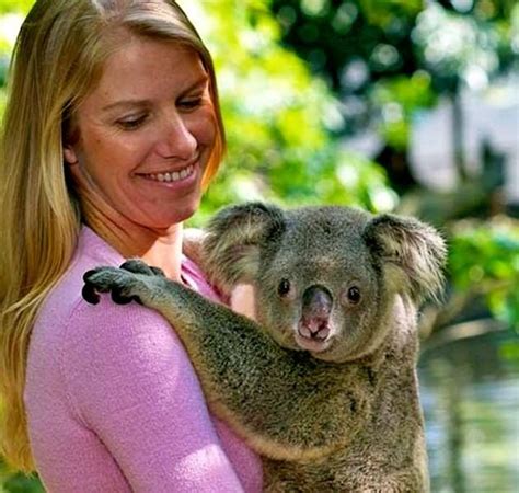 A Woman Holding A Koala At The Australian Zoo Sydney Australia