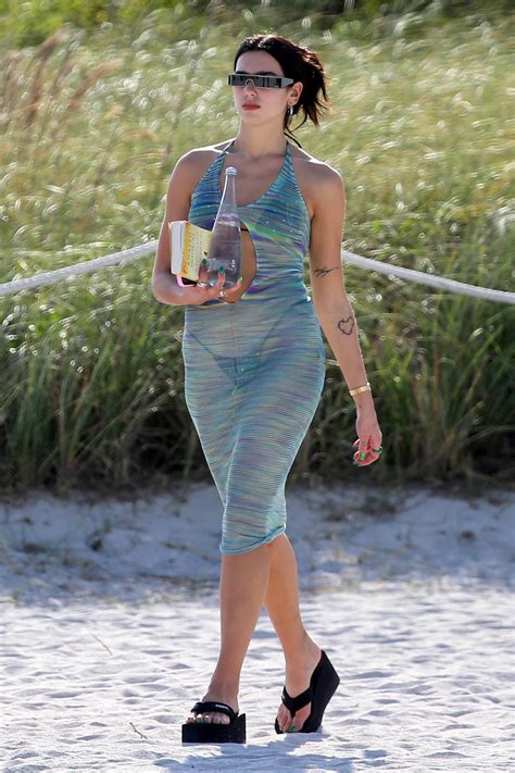 Dua Lipa Wears A Sheer Dress Over Her Bikini During A Relaxing Beach