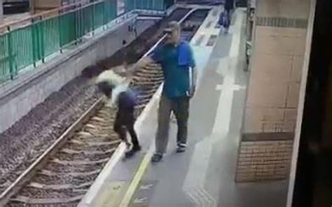 Shocking Moment Man Pushes Woman Onto Train Tracks In Hong Kong