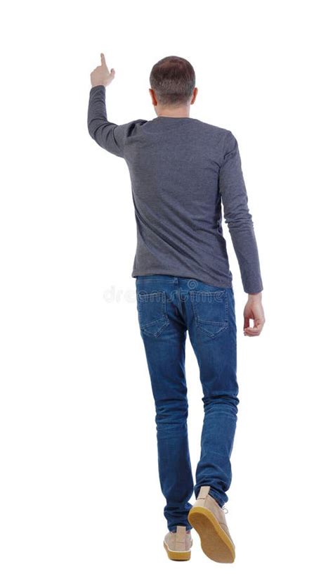 Back View Of A Man Walking With A Pointing Hand Stock Photo Image Of