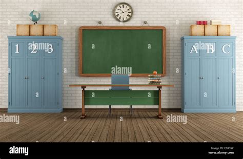 Vintage Classroom With Blackboard Teachers Desk And Two Wooden