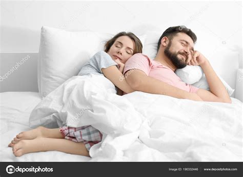 Husband And Wife Sleeping Together