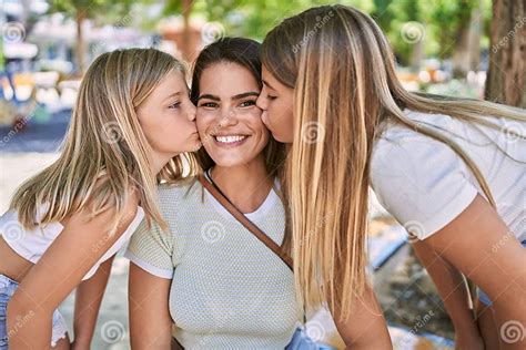 Mother And Daughters Kissing And Hugging Each Other Standing At Park Stock Image Image Of