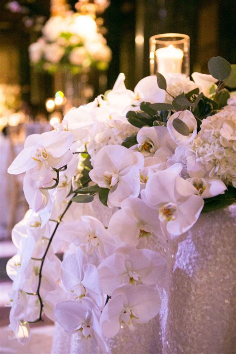 Orchids Cascading Off Sweetheart Table