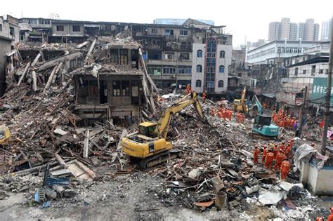 China Building Collapse Little Girl Survives In Dead Parents Arms