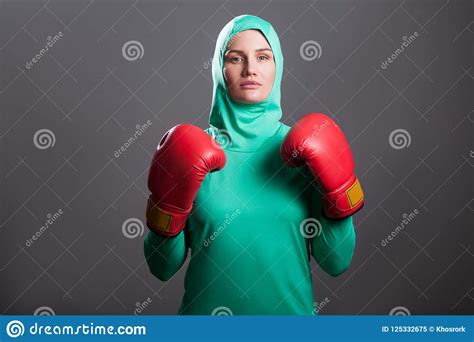 Serious Boxing Athlete Muslim Woman In Green Hijab Or Islamic Sp Stock