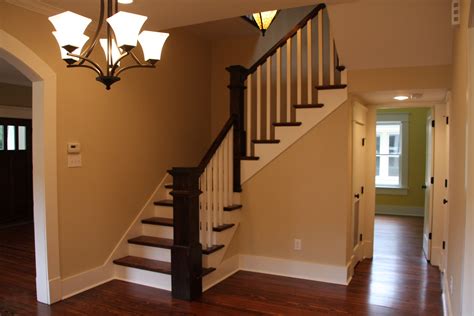 Dining room with staircase and hallway to downstairs bedroom Downstairs