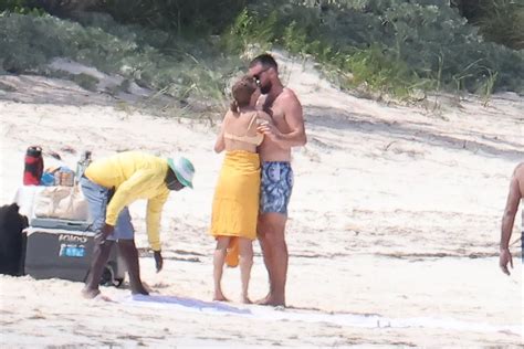 Taylor Swift Was Photographed Kissing Travis Kelce in a Yellow Bikini ...