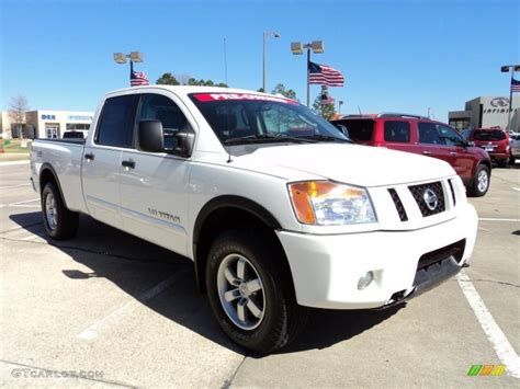 On certain models you can opt for a center outside the bed, nissan has placed a clever storage bin just behind left the rear wheel. 2008 Blizzard White Nissan Titan Pro-4X Crew Cab 4x4 ...