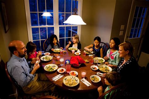 Imagine the scene of a family with mother and children cooking dinner together at weekend. Family Dinner: Treasured Tradition Or Bygone Ideal ...