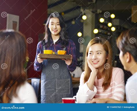 asian waitress talking with client in restaurant stock image 22629091