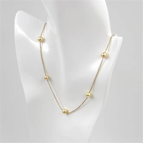This necklace shines with real 14k gold plating and a unique st genevieve design only sold by benevolence la. 14Kt Yellow Gold Chain Necklace with Seven Golden Cultured Pearls - S & K Ltd.