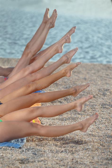 Several Girls In Bikini Lying On Sandy Beach Stock Photo Image Of