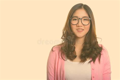 Portrait Of Happy Young Beautiful Asian Nerd Woman With Eyeglasses