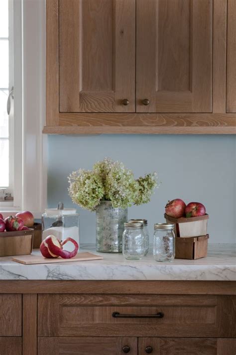 Engineered quartz countertops by caesarstone cabinets. lime washed wood cabinets with marble {pretty!} | Brown ...