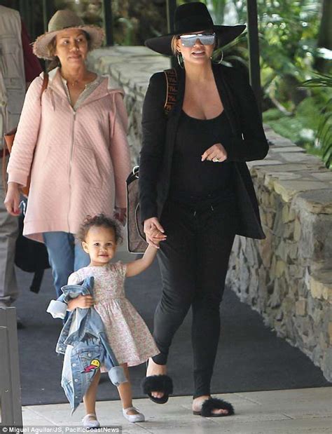 Chrissy teigen confirms her parents' divorce: Chrissy Teigen displays baby bump as she enjoys family ...