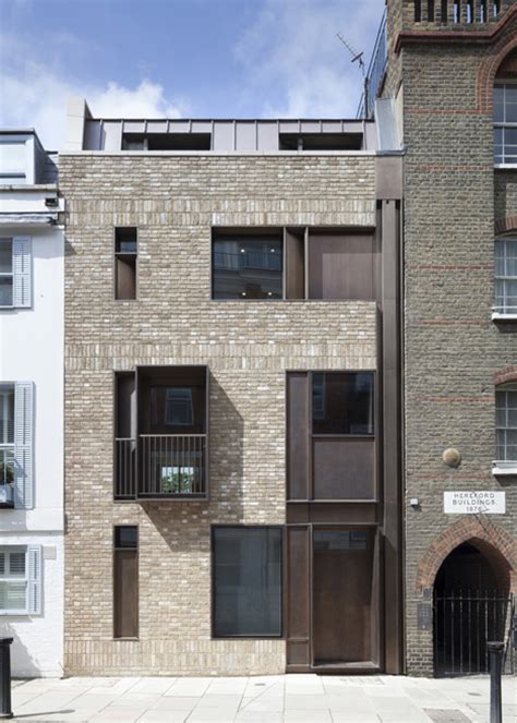 tdo pairs brick and bronze for contemporary london house