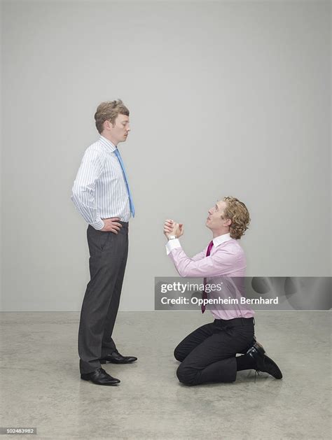 Businessman Begging On His Knees High Res Stock Photo Getty Images