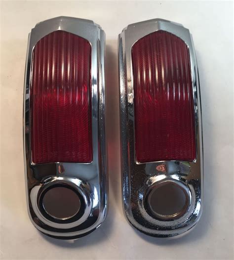 Vintage Car Tail Lights On White Table