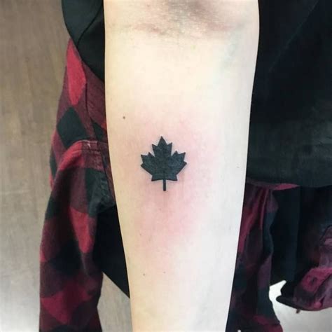 Small Black Maple Leaf Tattoo On The Inner Forearm Small Tattoos For