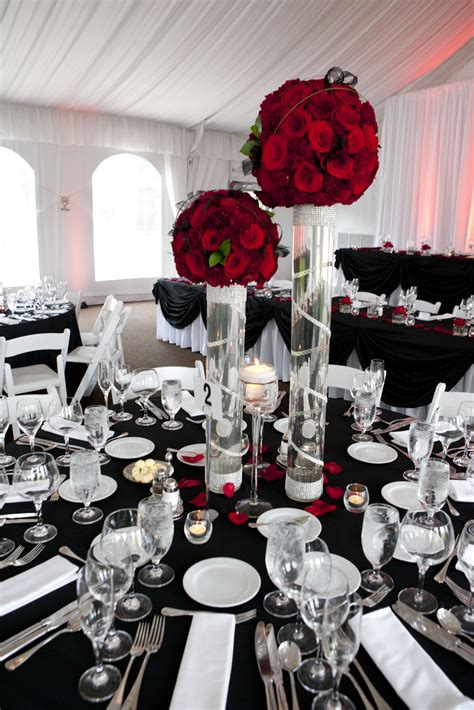 Wedding centrepieces & table decors. perfect black and white wedding with a lovely touch of red ...