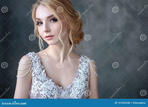 Bride Blonde Woman In A Modern Color Wedding Dress With Elegant Hair