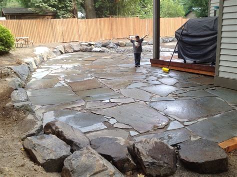 Flagstone is a popular outdoor flooring material. Flagstone patio installation - Yelp