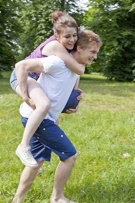 Boy Carrying Girlfriend Piggyback Stock Image F0044582 Science