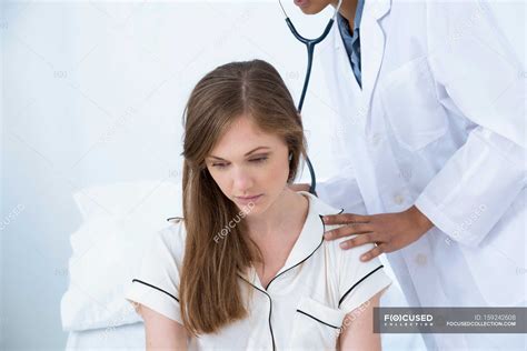 Doctor Examining Patient With Stethoscope — Two People Lab Coat