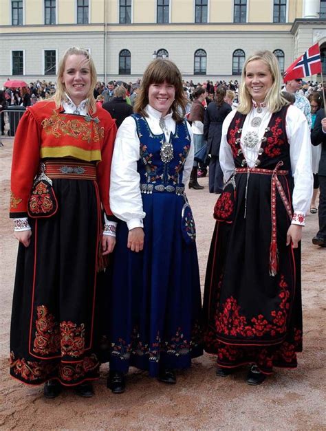three norwegians in national costume in front of the royal palace 2008 in oslo scandinavian