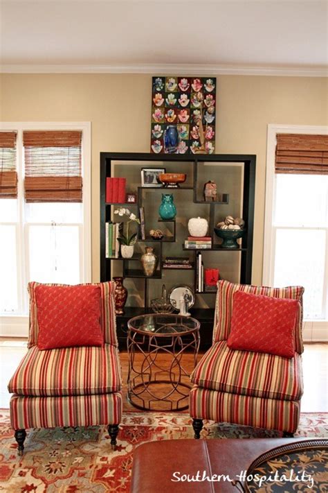 Place a slipper chair at each end of a long dining table and flank the sides with simpler dining chairs. living room makeover on a budget