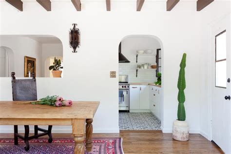 White Dining Room With Arched Door And Pass Thru To Kitchen Hgtv