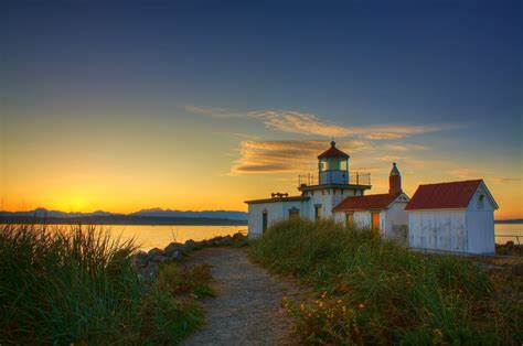 Last Rays Of Sunlight Shine Upon The West Point Lighthouse In The