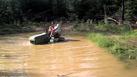 It is better to water deeply and infrequently. Going through deep water with a lawn tractor. - YouTube