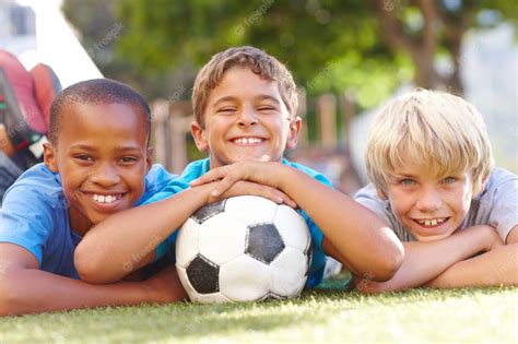 Premium Photo A Winning Team Of Best Friends Three Happy Boys Lying