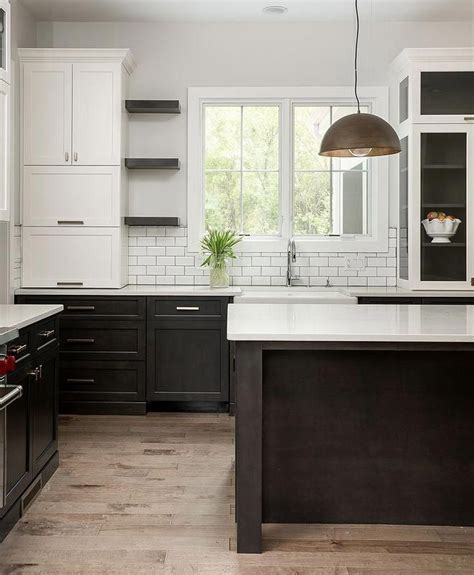 Two Toned Kitchen With White Upper Cabinets And Dark Stained Lower