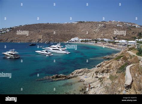 Psarou Beach Bay Mykonos Island Greece With Blue Sky Sea And Yachts