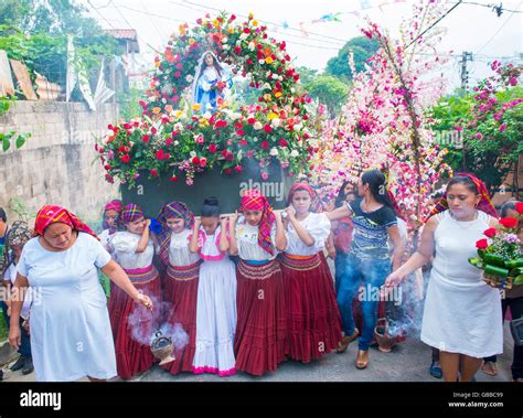salvadorian people participate in the procession of the flower and palm festival in panchimalco